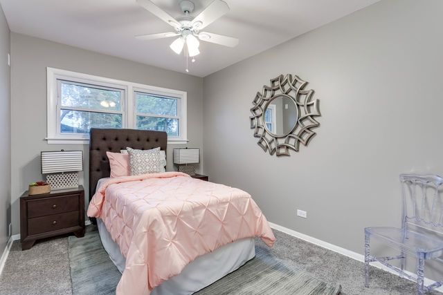 7500 Beckwith Road Morton Grove, IL 60053 - Photo 9 of 27 a bedroom with a bed and a window