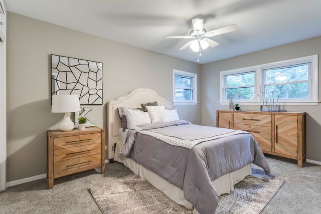 7500 Beckwith Road Morton Grove, IL 60053 - Photo 10 of 27 a bedroom with a bed and window