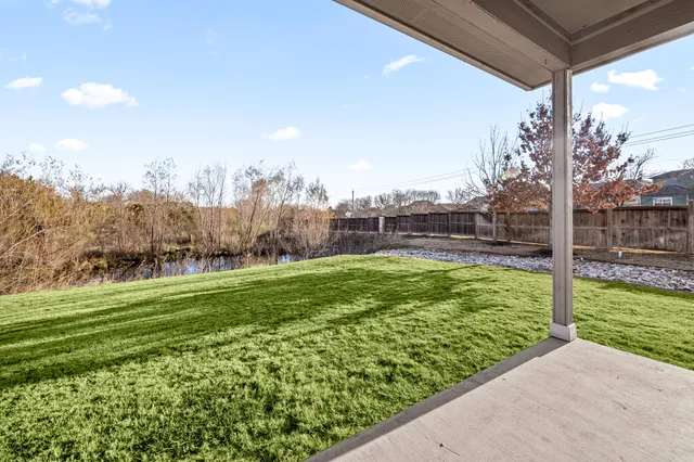 a view of a garden with a apartment