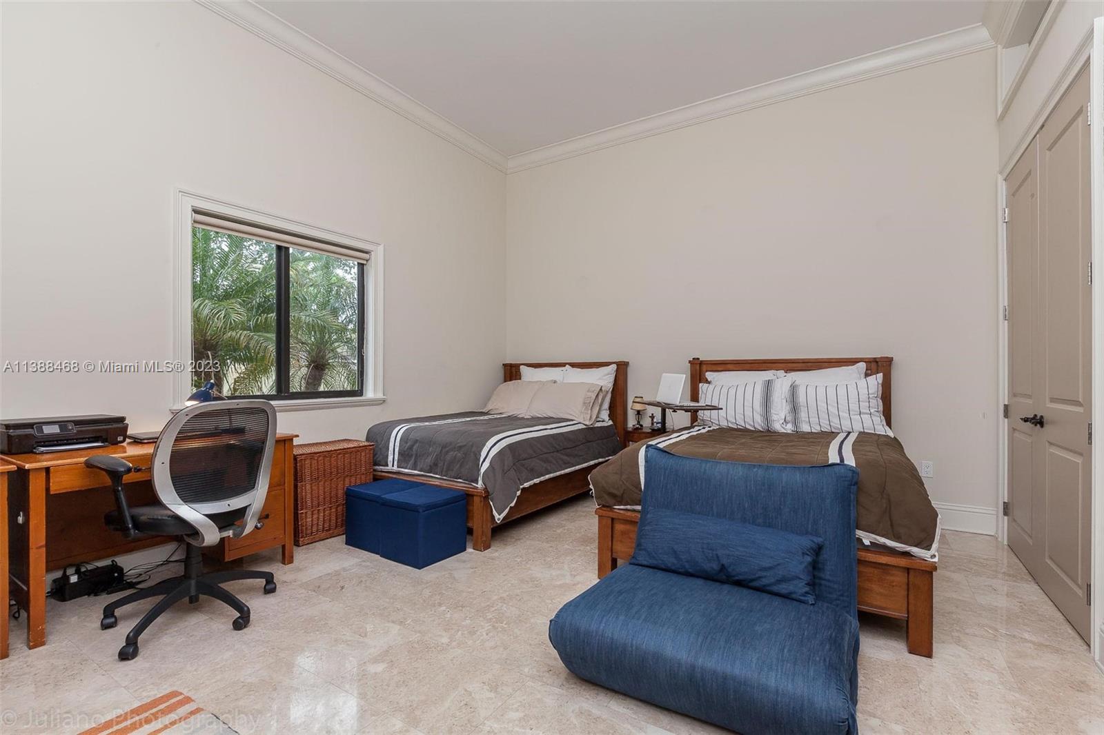 6874 Southwest 57th Terrace Miami, FL 33143 - Photo 21 of 36 a bedroom with a bed and a window