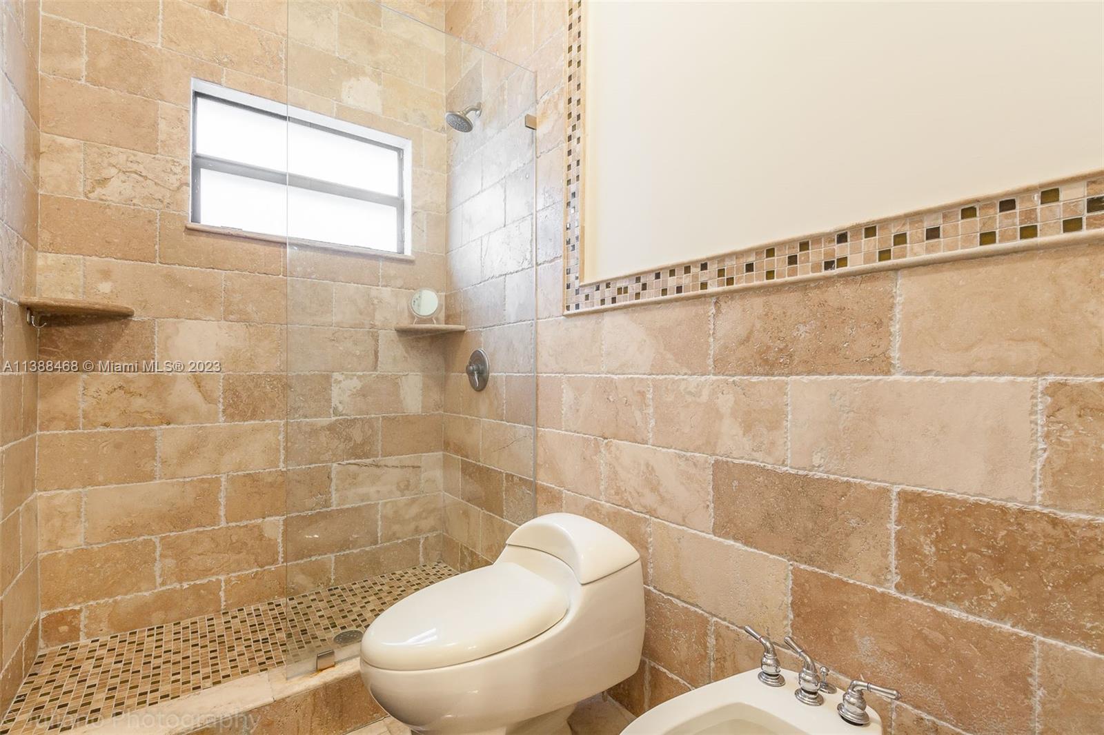 6874 Southwest 57th Terrace Miami, FL 33143 - Photo 22 of 36 a white toilet sitting next to a bathroom sink