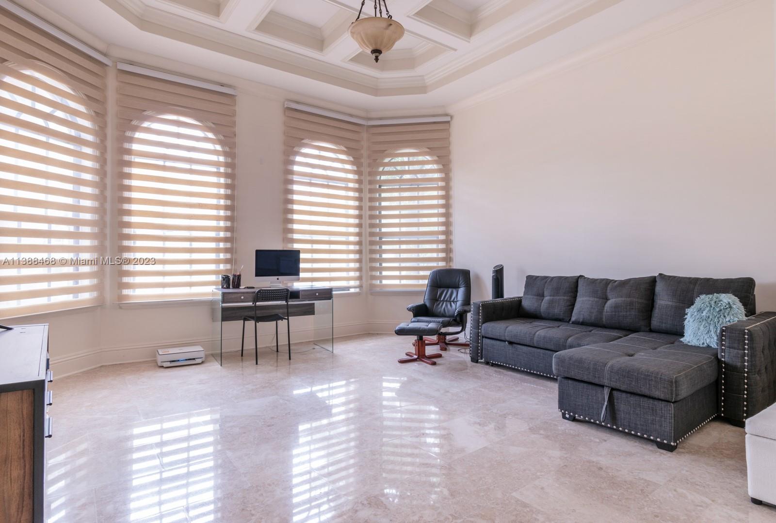 6874 Southwest 57th Terrace Miami, FL 33143 - Photo 26 of 36 a living room with furniture and a window
