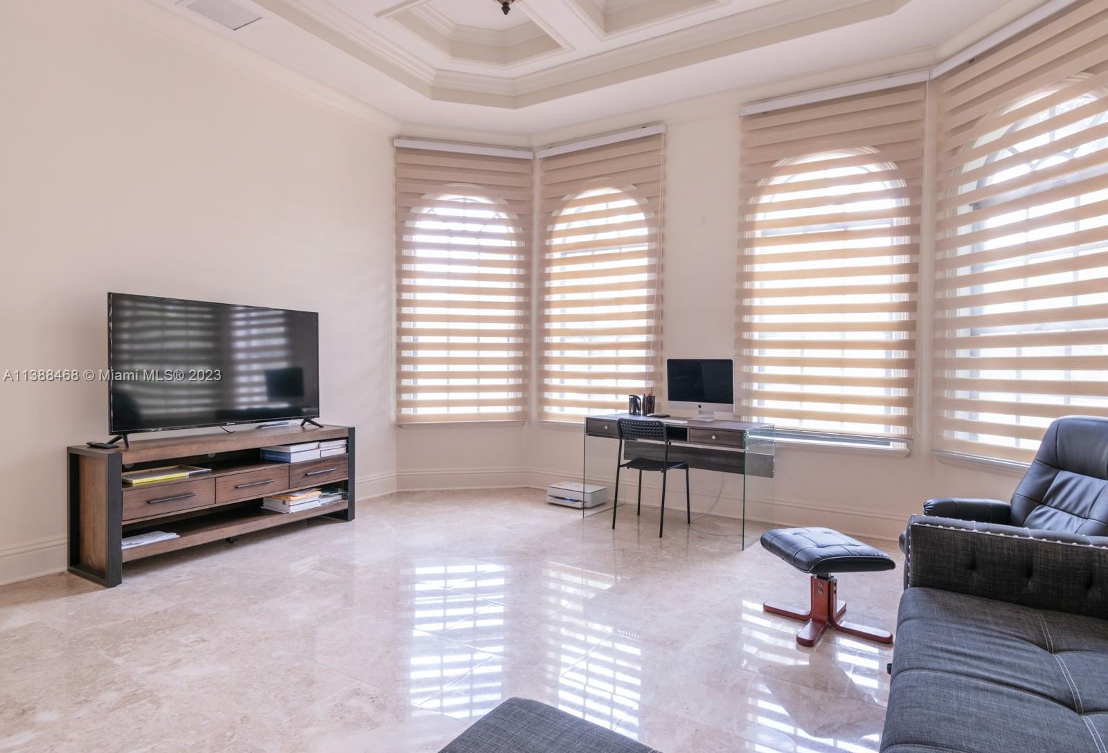 6874 Southwest 57th Terrace Miami, FL 33143 - Photo 27 of 36 a living room with furniture and a window