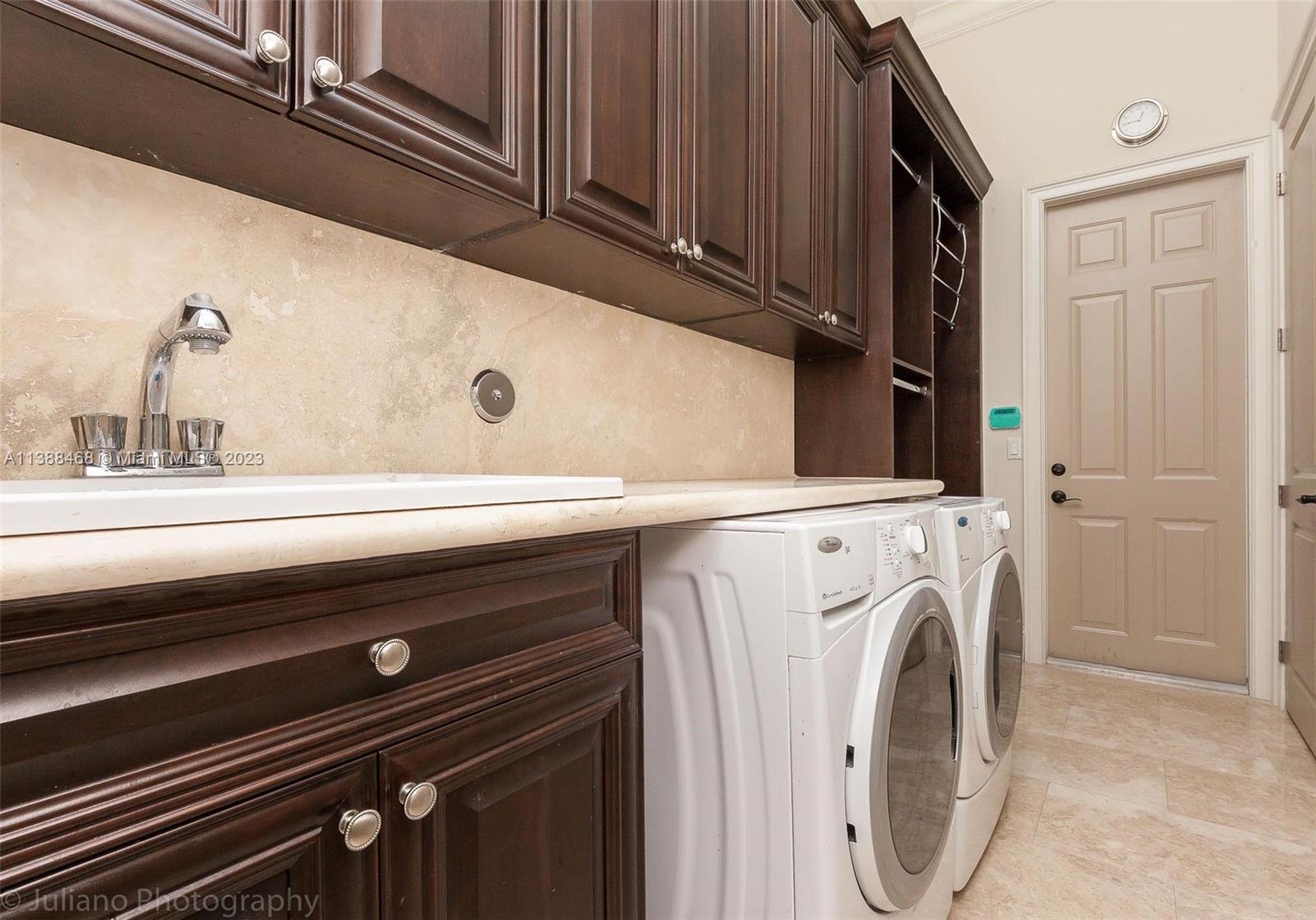 6874 Southwest 57th Terrace Miami, FL 33143 - Photo 28 of 36 a close up view of washer and dryer