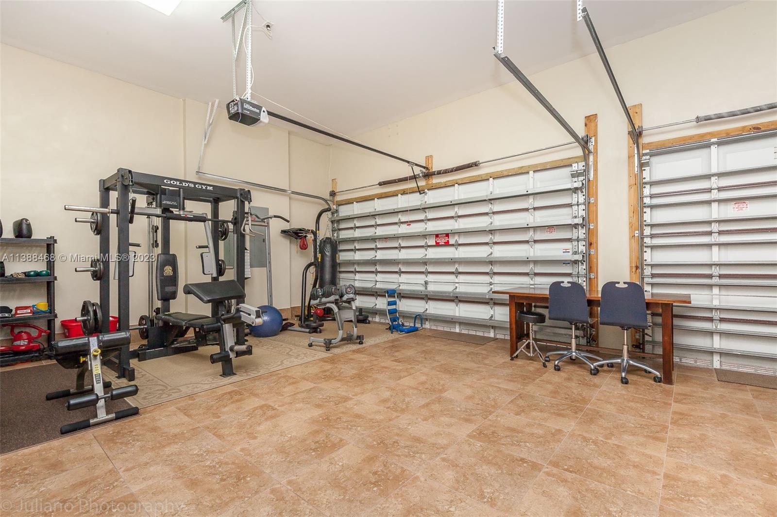 6874 Southwest 57th Terrace Miami, FL 33143 - Photo 30 of 36 a view of a room with gym equipment