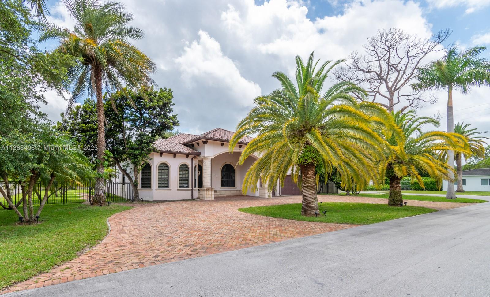 6874 Southwest 57th Terrace Miami, FL 33143 - Photo 3 of 36 a view of multiple houses with yard and green space