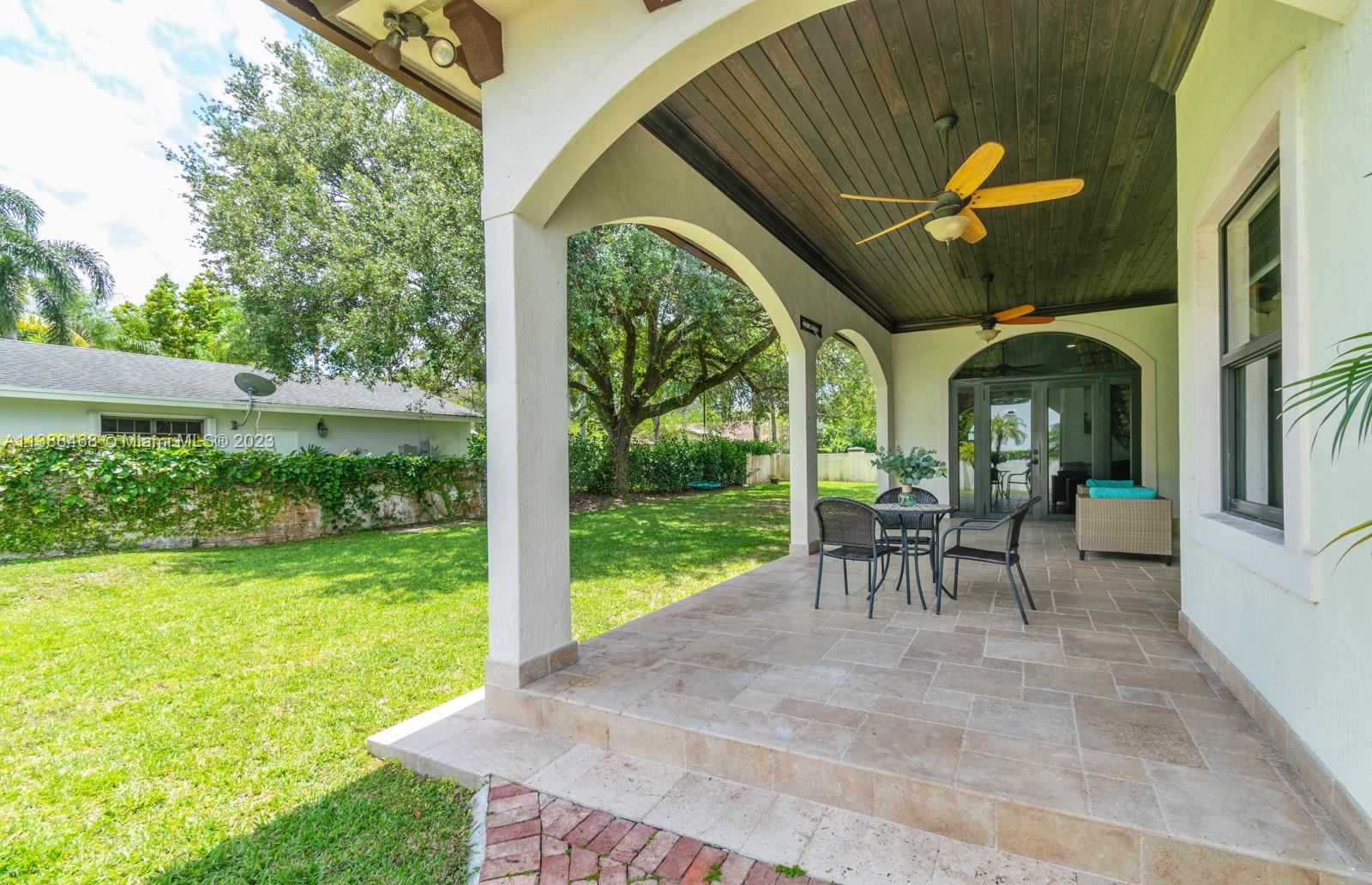 6874 Southwest 57th Terrace Miami, FL 33143 - Photo 32 of 36 a view of a porch with furniture and garden