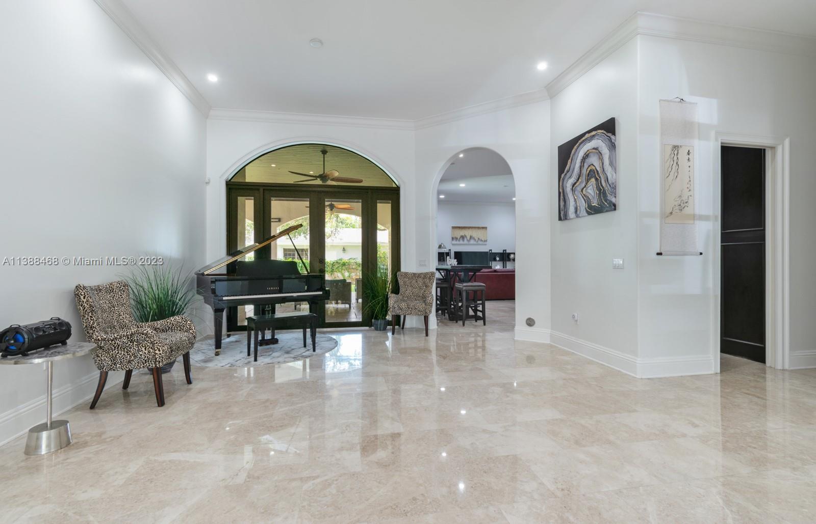 6874 Southwest 57th Terrace Miami, FL 33143 - Photo 5 of 36 a view of a livingroom with furniture and a potted plant