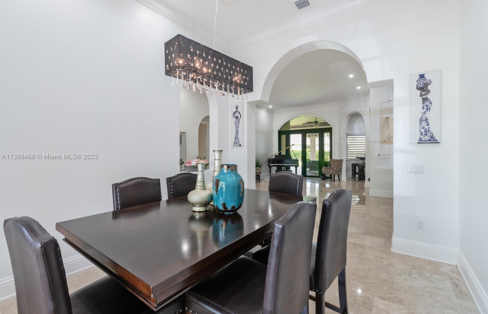 6874 Southwest 57th Terrace Miami, FL 33143 - Photo 7 of 36 a view of a dining room with furniture and wooden floor