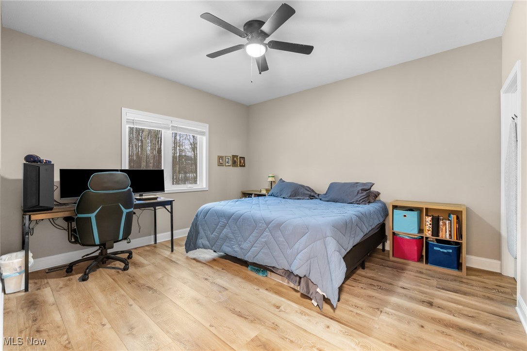 39600 Aurora Road Solon, OH 44139 - Photo 18 of 49 1st Floor Bedroom with a ceiling fan and an office area