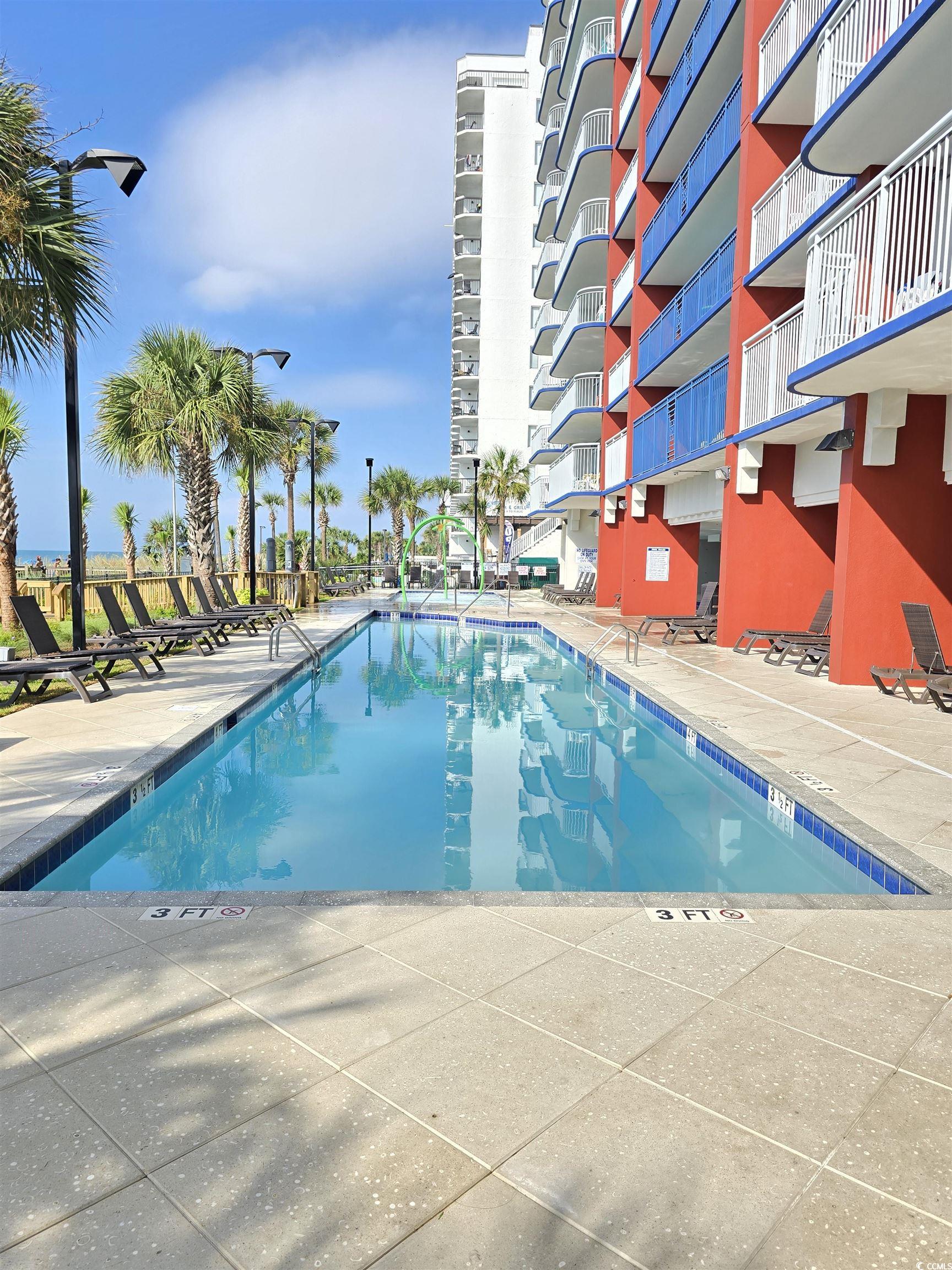 2007 South Ocean Boulevard, Unit 1607 Myrtle Beach, SC 29577 - Photo 28 of 31 Community pool featuring a patio