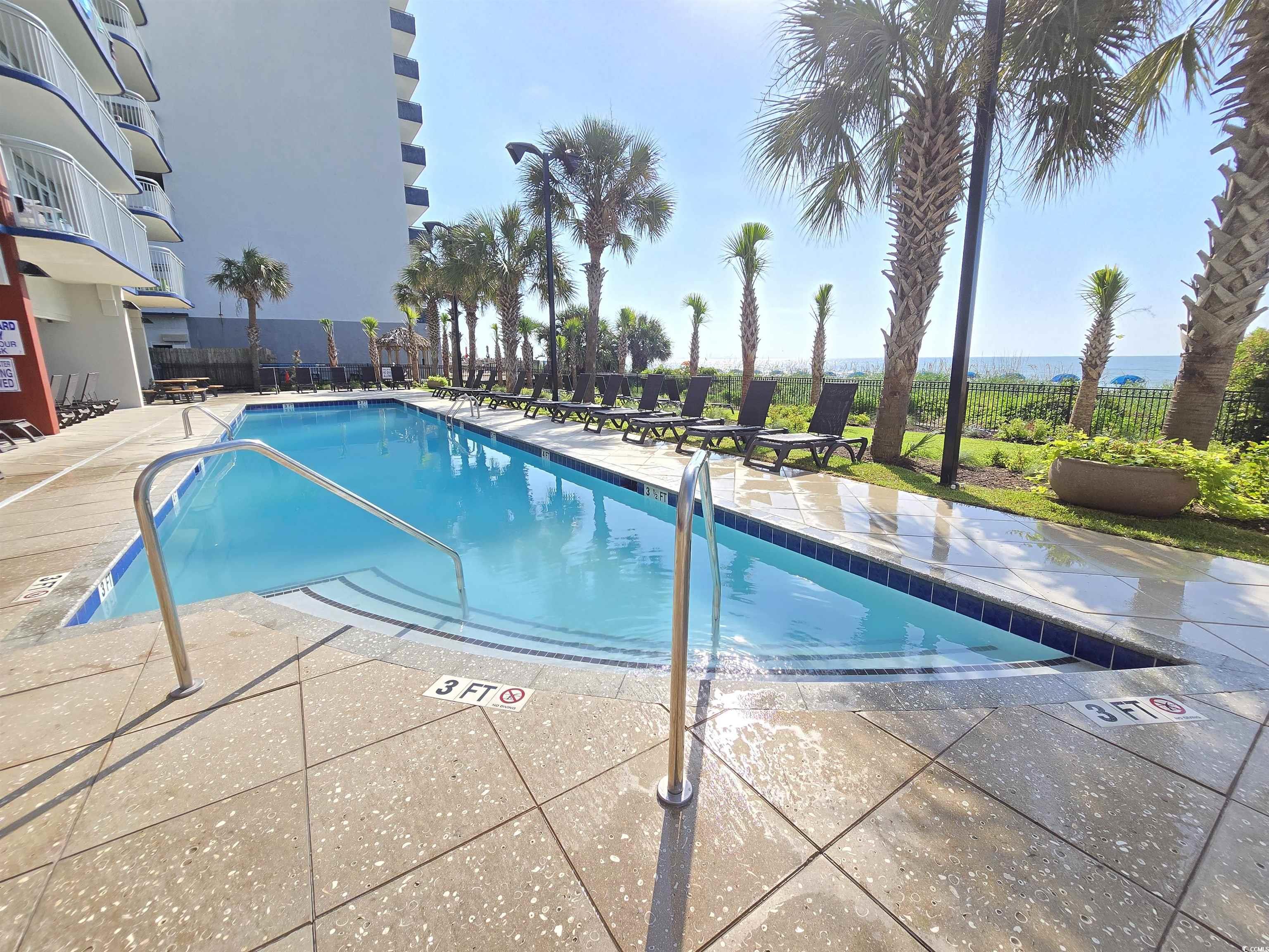 2007 South Ocean Boulevard, Unit 1607 Myrtle Beach, SC 29577 - Photo 29 of 31 Community pool featuring a patio area