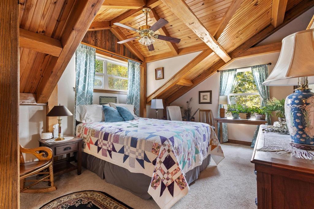 312 County Road 2100 Detroit, TX 75436 - Photo 16 of 39 a bed sitting in a bedroom next to a window