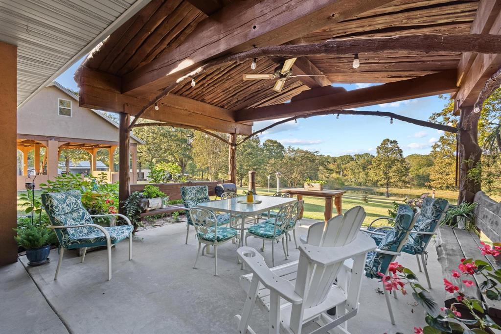 312 County Road 2100 Detroit, TX 75436 - Photo 20 of 39 a view of a balcony with chairs and a table