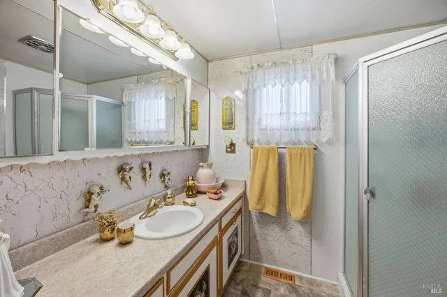 a backyard of a house with lots of green space and a fountain