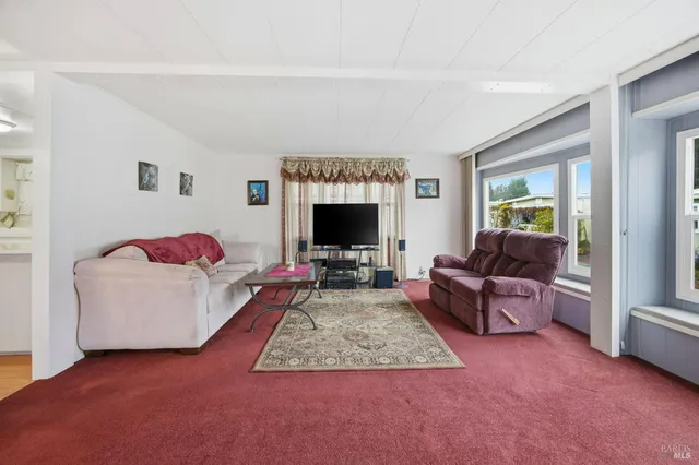 a kitchen with white cabinets and white stainless steel appliances