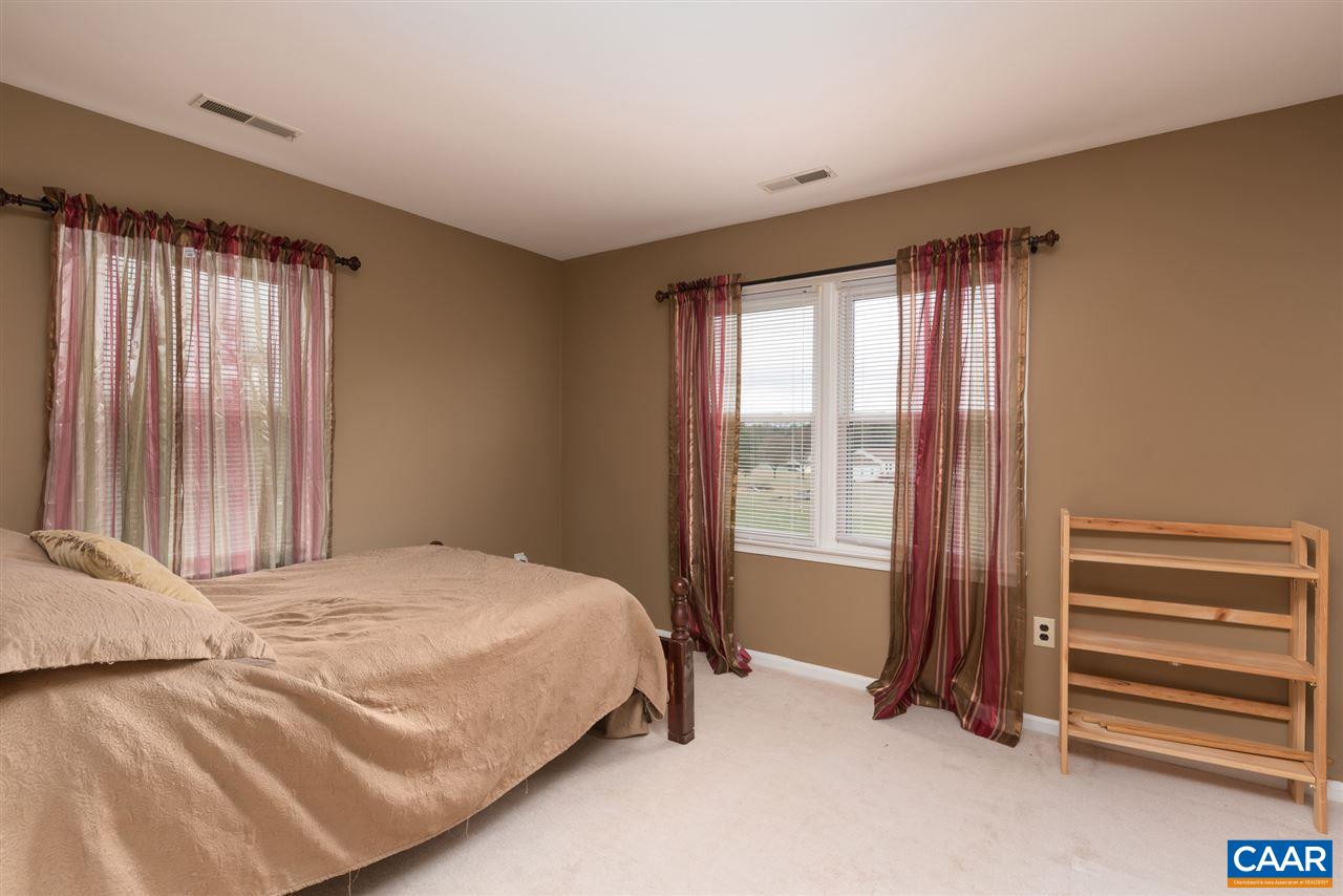 706 Zion Road Zion Crossroads, VA 22942 - Photo 26 of 38 a bedroom with a bed and a window