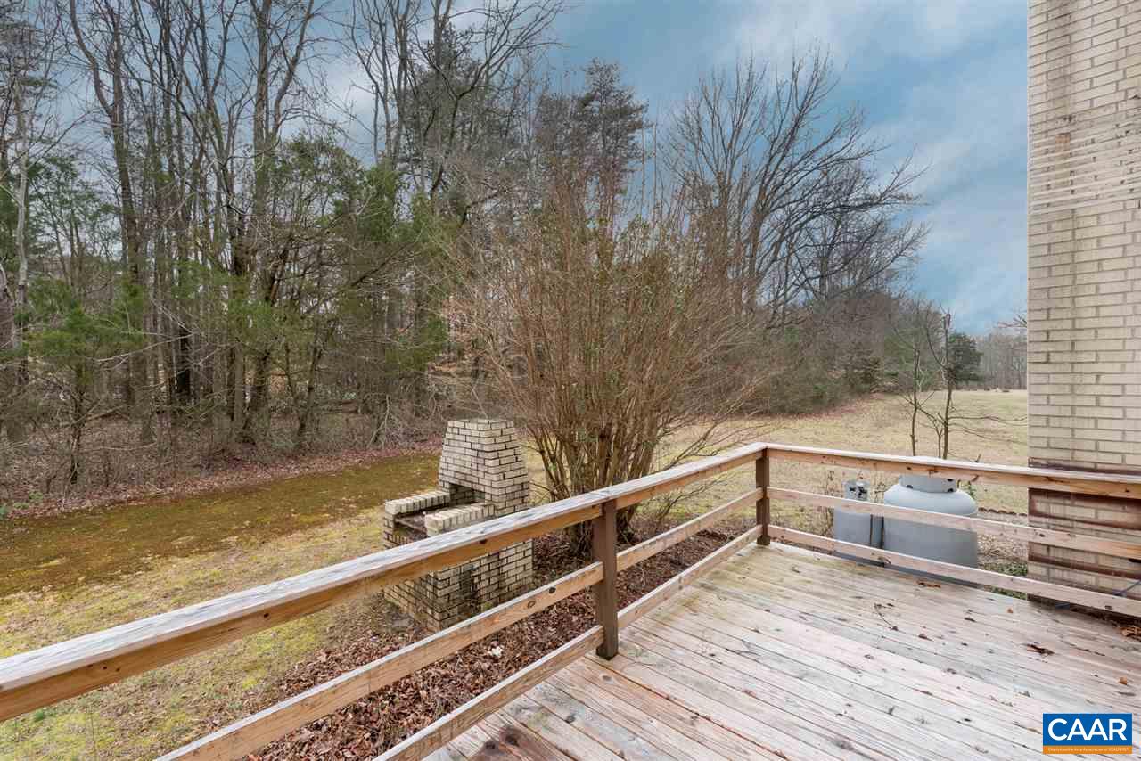 706 Zion Road Zion Crossroads, VA 22942 - Photo 37 of 38 a view of a balcony with wooden floor and fence