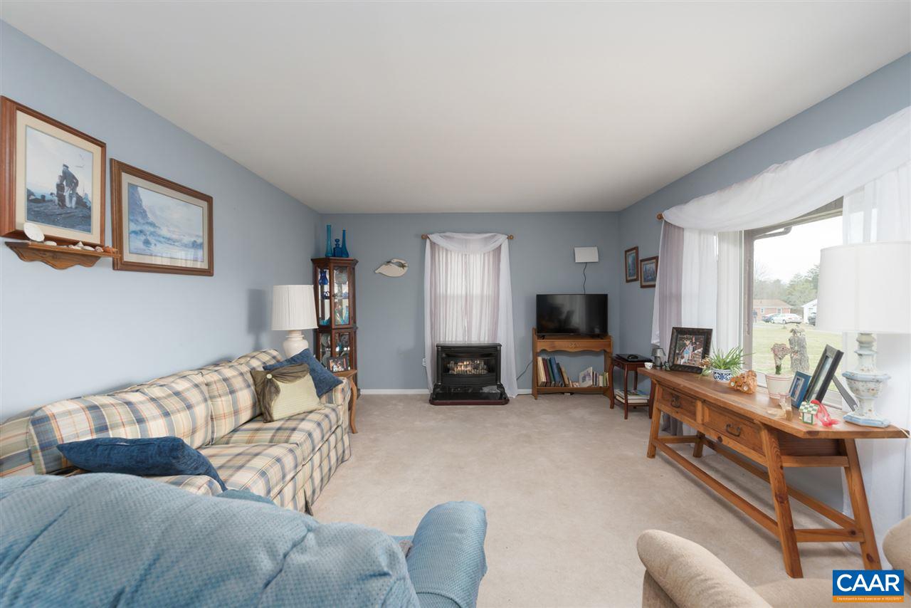 706 Zion Road Zion Crossroads, VA 22942 - Photo 5 of 38 a living room with furniture and a flat screen tv