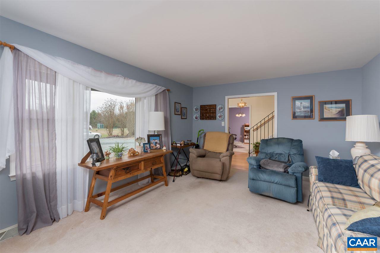 706 Zion Road Zion Crossroads, VA 22942 - Photo 7 of 38 a bedroom with furniture and a large window
