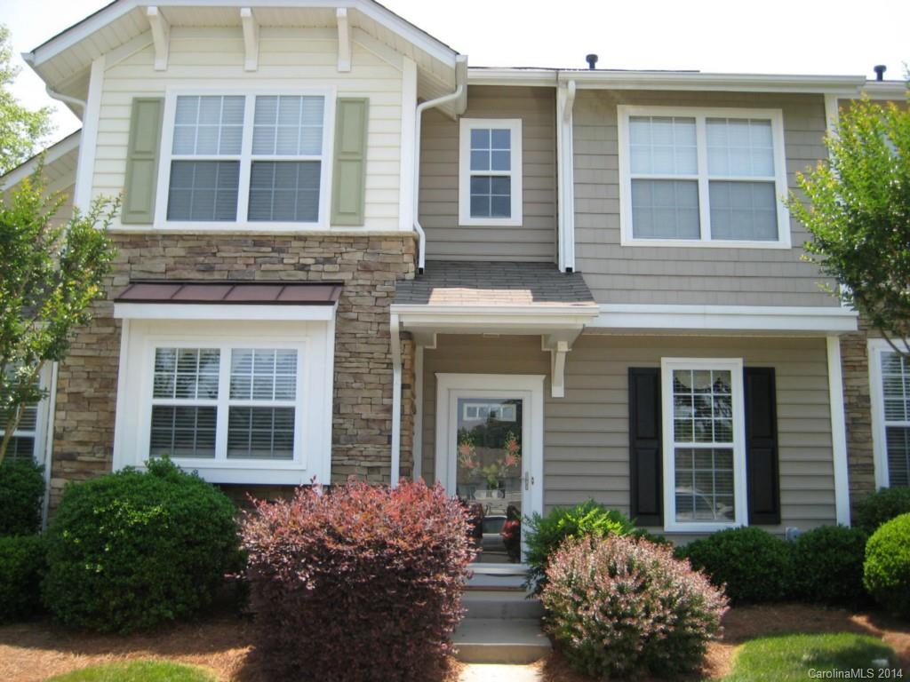 334 Sugar Ridge Court, Unit 102 Fort Mill, SC 29708 - Photo 1 of 18 front view of a brick house with a large windows and a large window