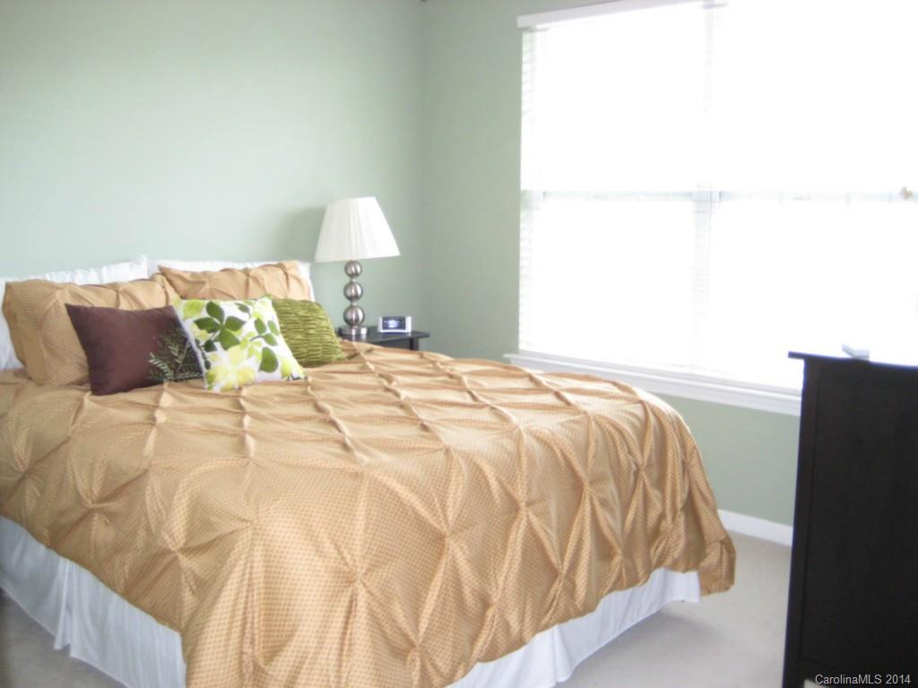 334 Sugar Ridge Court, Unit 102 Fort Mill, SC 29708 - Photo 14 of 18 a bedroom with a bed and a window