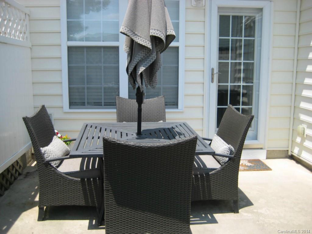 334 Sugar Ridge Court, Unit 102 Fort Mill, SC 29708 - Photo 16 of 18 a view of balcony and chair