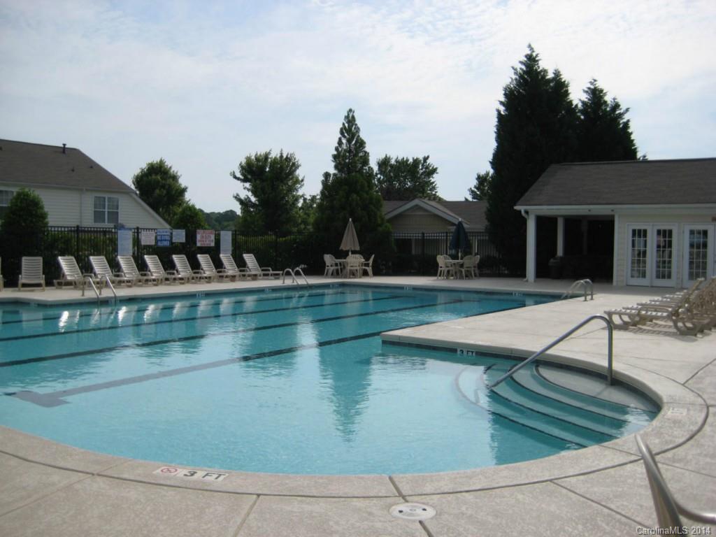 334 Sugar Ridge Court, Unit 102 Fort Mill, SC 29708 - Photo 18 of 18 a view of a house with pool and sitting area