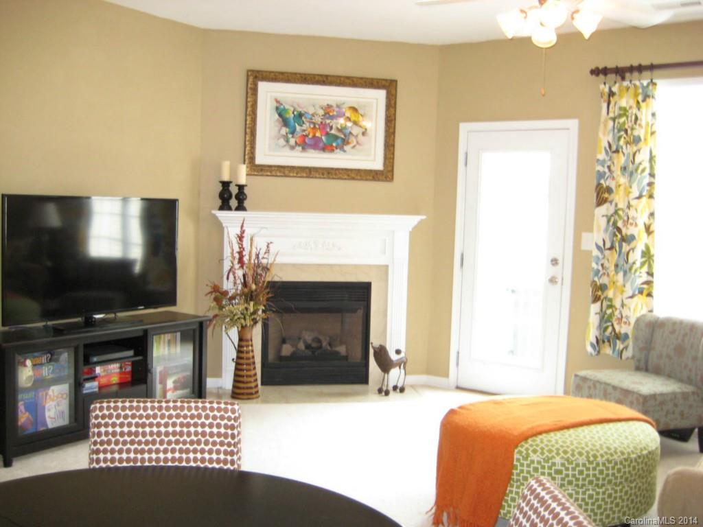 334 Sugar Ridge Court, Unit 102 Fort Mill, SC 29708 - Photo 4 of 18 a bedroom with a bed and a flat screen tv