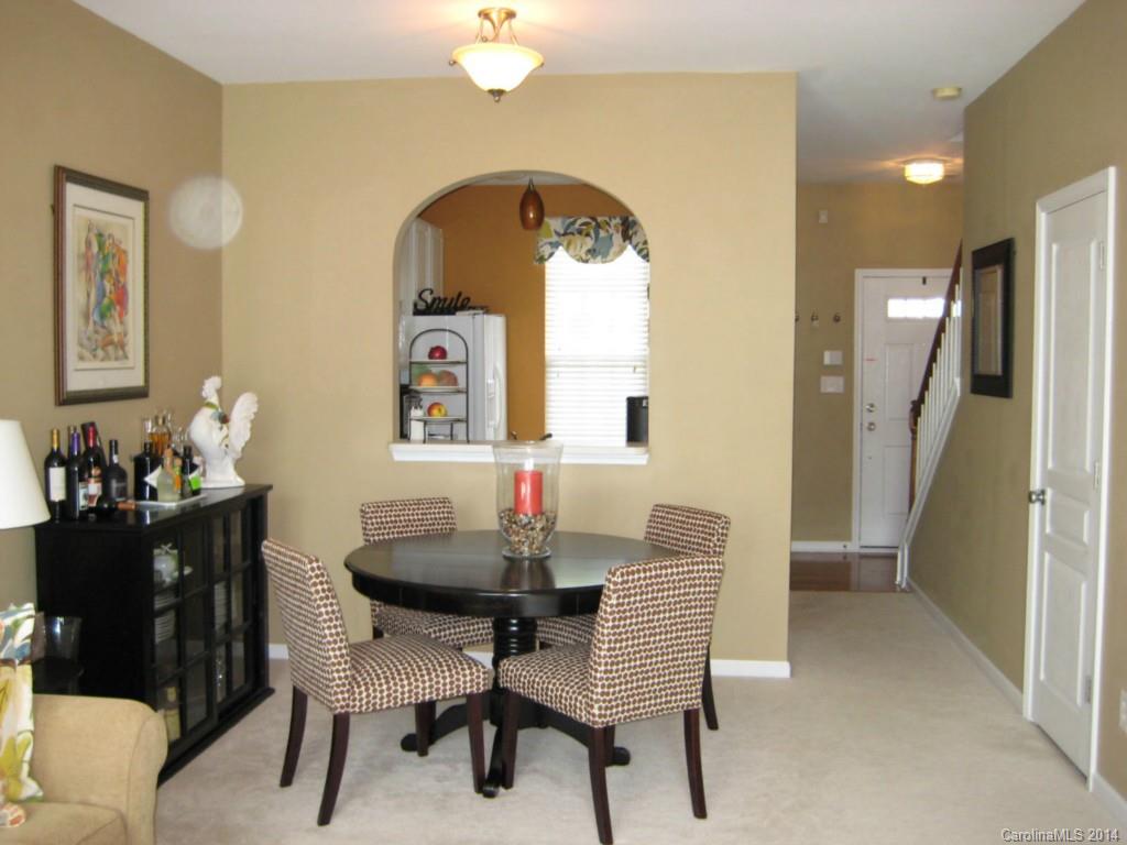 334 Sugar Ridge Court, Unit 102 Fort Mill, SC 29708 - Photo 5 of 18 a dining room with furniture and window