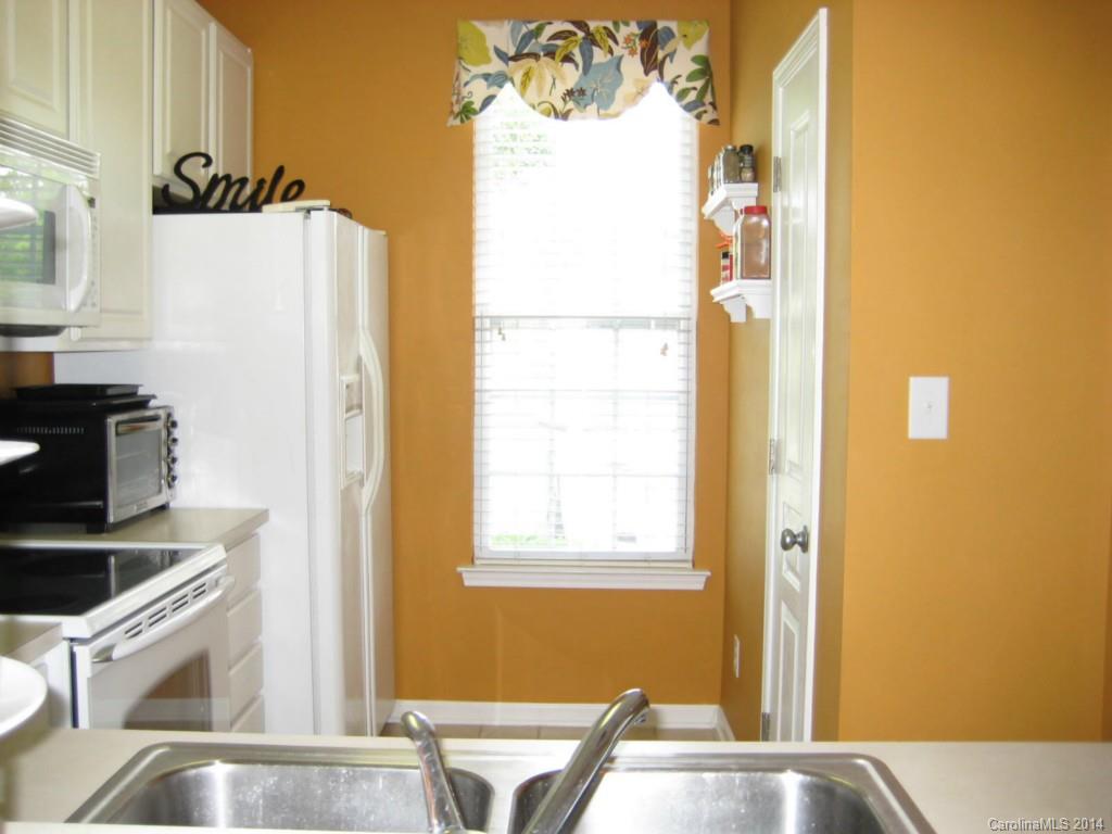 334 Sugar Ridge Court, Unit 102 Fort Mill, SC 29708 - Photo 10 of 18 a view of a kitchen with appliances and cabinets