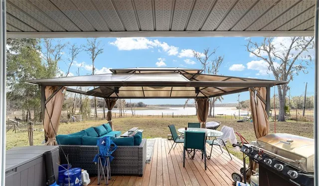 a view of a backyard with sitting area