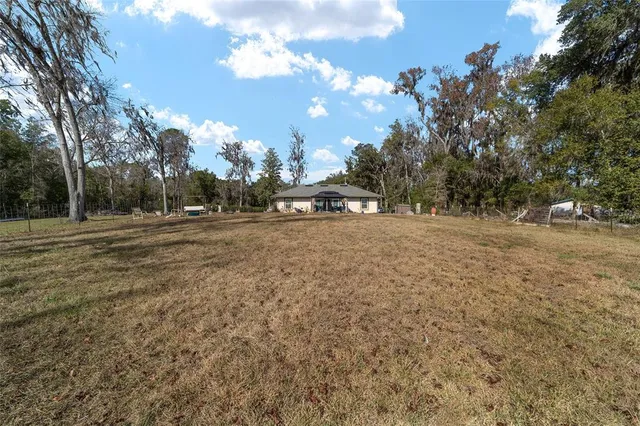 a view of a lake with a building in the background