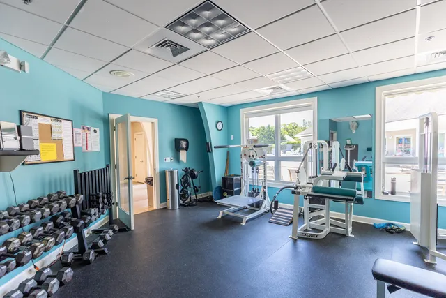 a sign that is on the side of a brick building