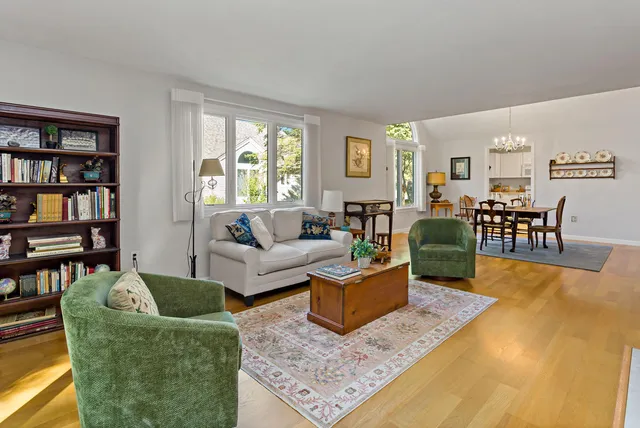 a living room with furniture rug and window