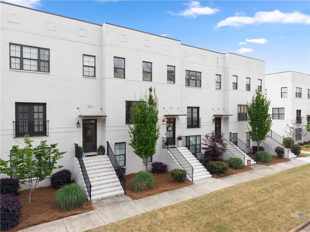 3206 Ridge Towne Place Duluth, GA 30096 - Photo 33 of 42 a view of a house with backyard sitting area and garden