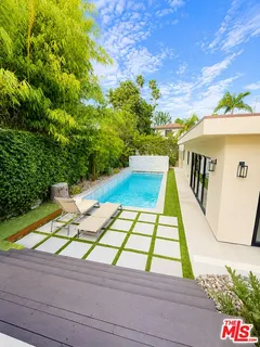 a view of swimming pool with seating area