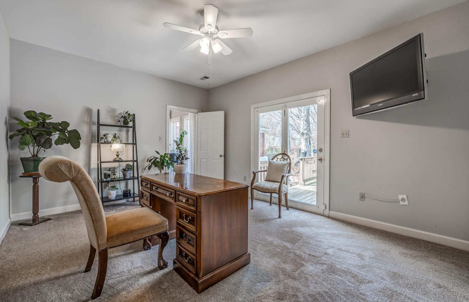 601 North Walnut Bend Road Memphis, TN 38018 - Photo 11 of 25 a view of a livingroom with furniture and a flat screen tv
