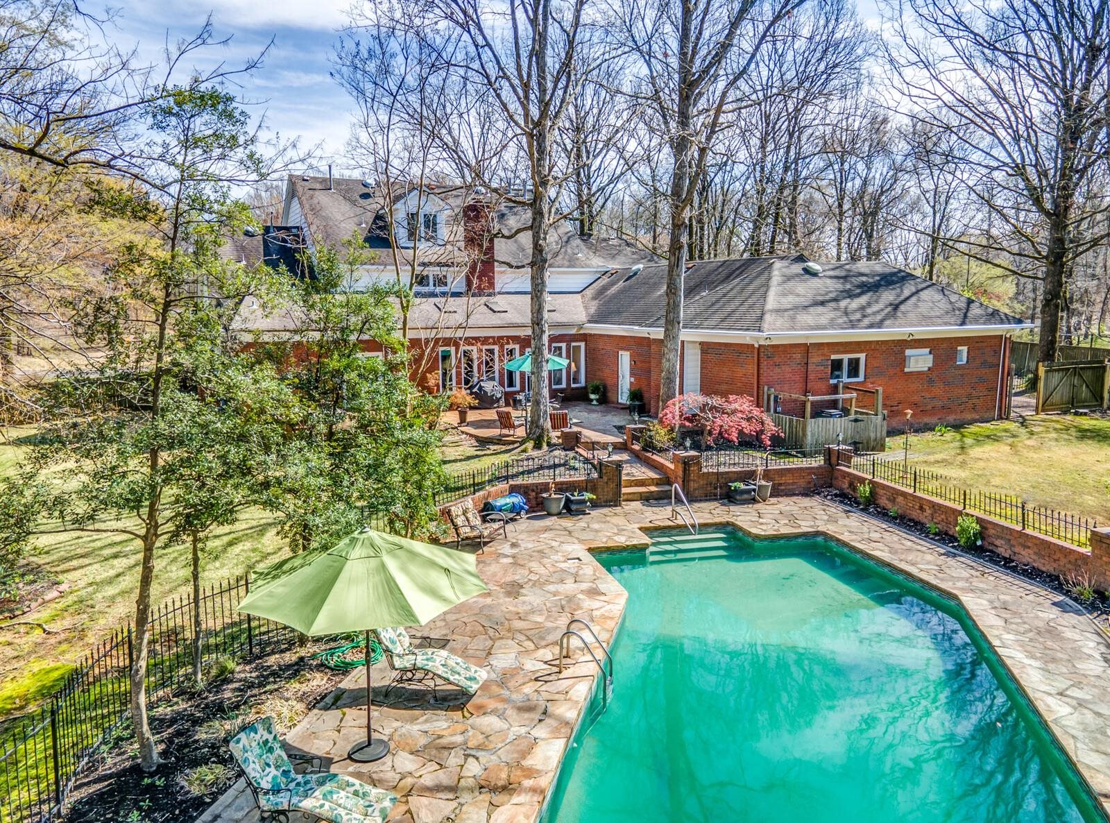 601 North Walnut Bend Road Memphis, TN 38018 - Photo 23 of 25 a view of a house with swimming pool and sitting area