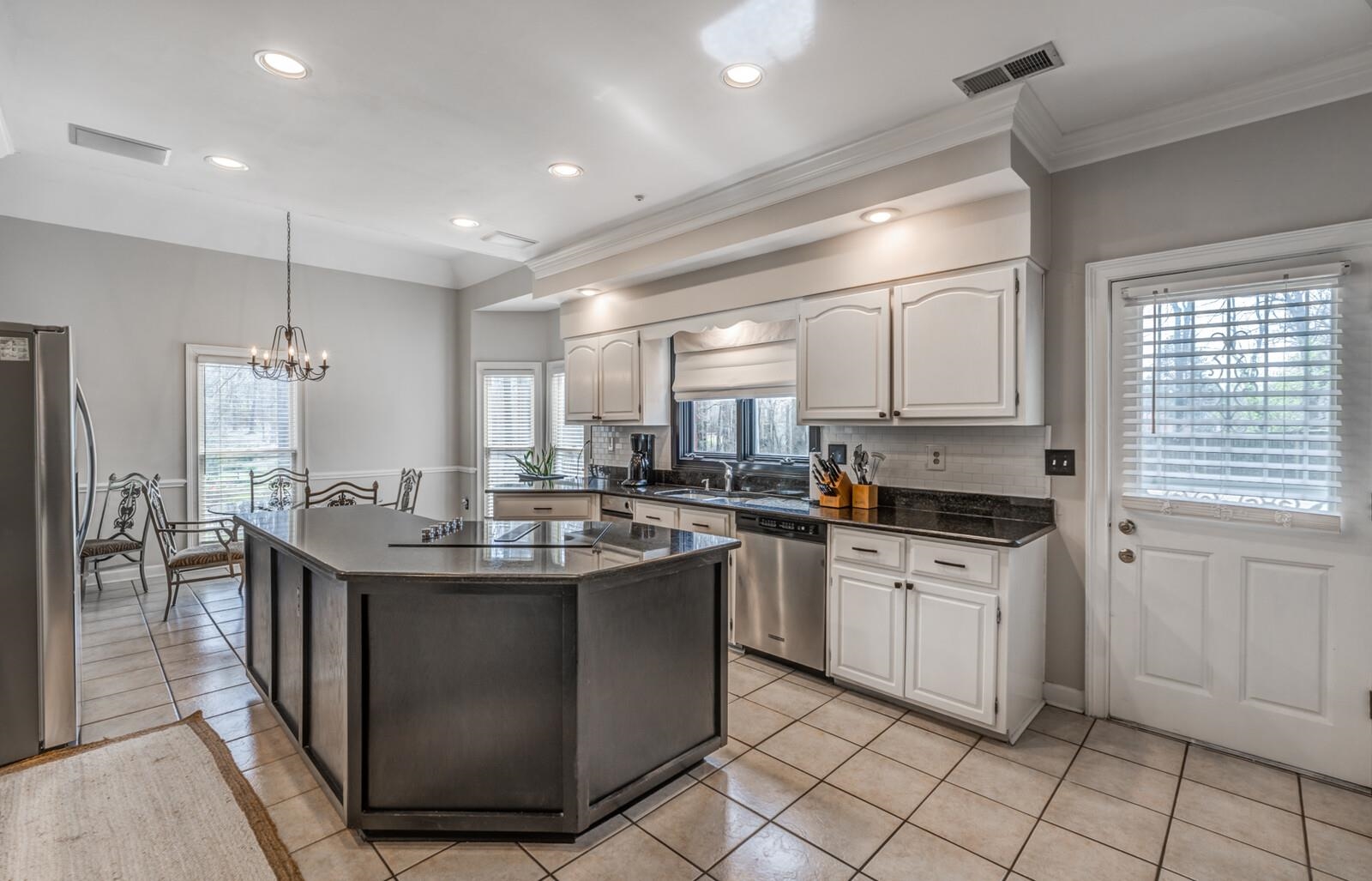601 North Walnut Bend Road Memphis, TN 38018 - Photo 5 of 25 a kitchen with stainless steel appliances granite countertop a sink and cabinets