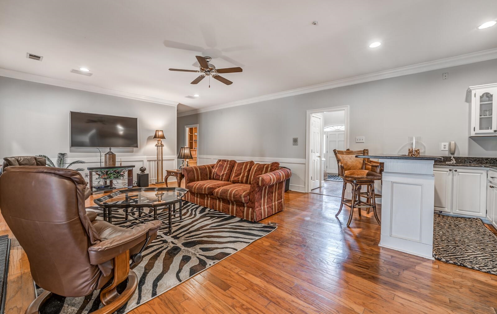 601 North Walnut Bend Road Memphis, TN 38018 - Photo 7 of 25 a living room with furniture a flat screen tv and kitchen view