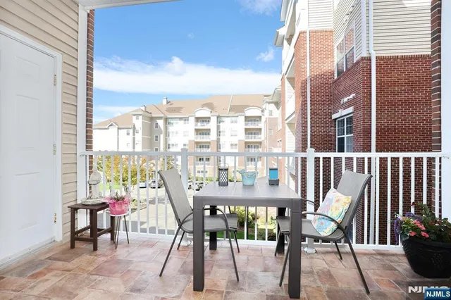 a view of a balcony with chairs