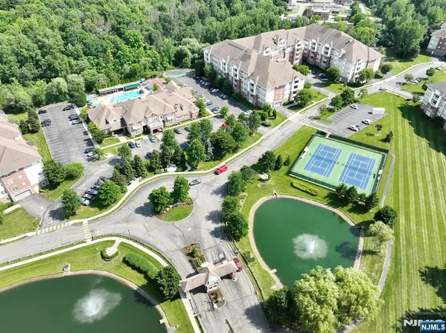 an aerial view of a house with a swimming pool