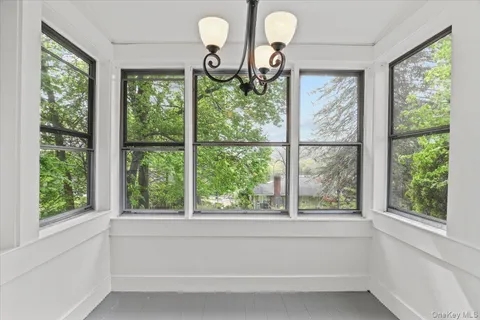 a view of empty room with wooden ceiling