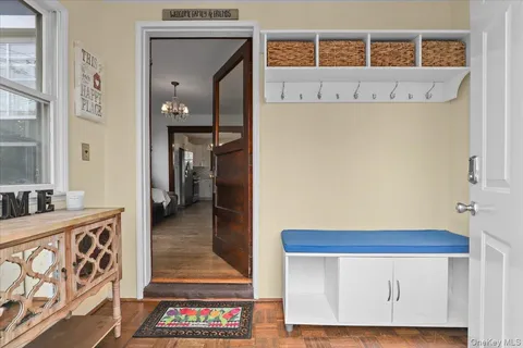 a view of an entryway with wooden floor
