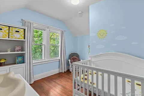 a bathroom with a tub and window