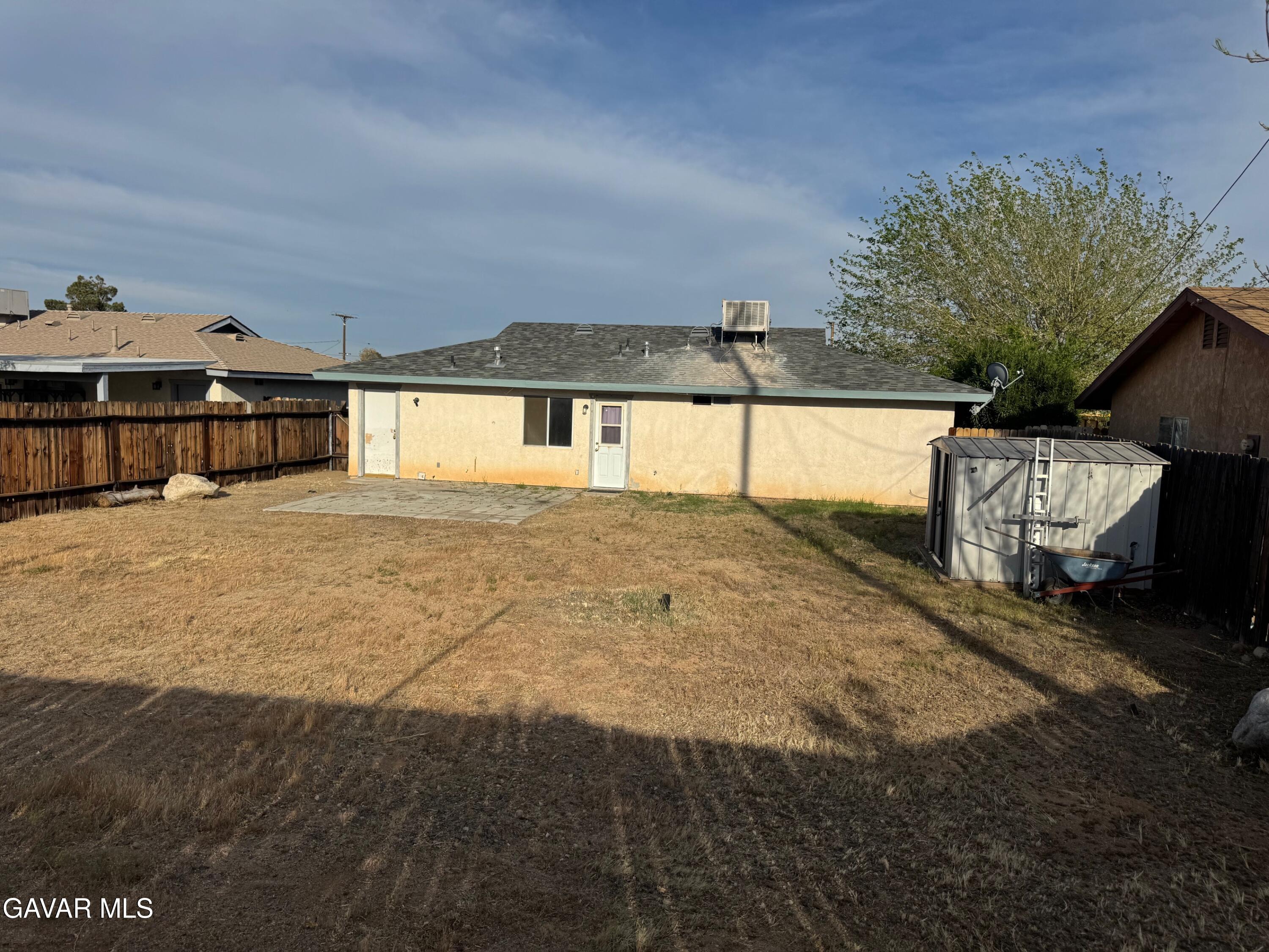 1105 South McCall Street Ridgecrest, CA 93555 - Photo 11 of 12 a view of a house with a yard
