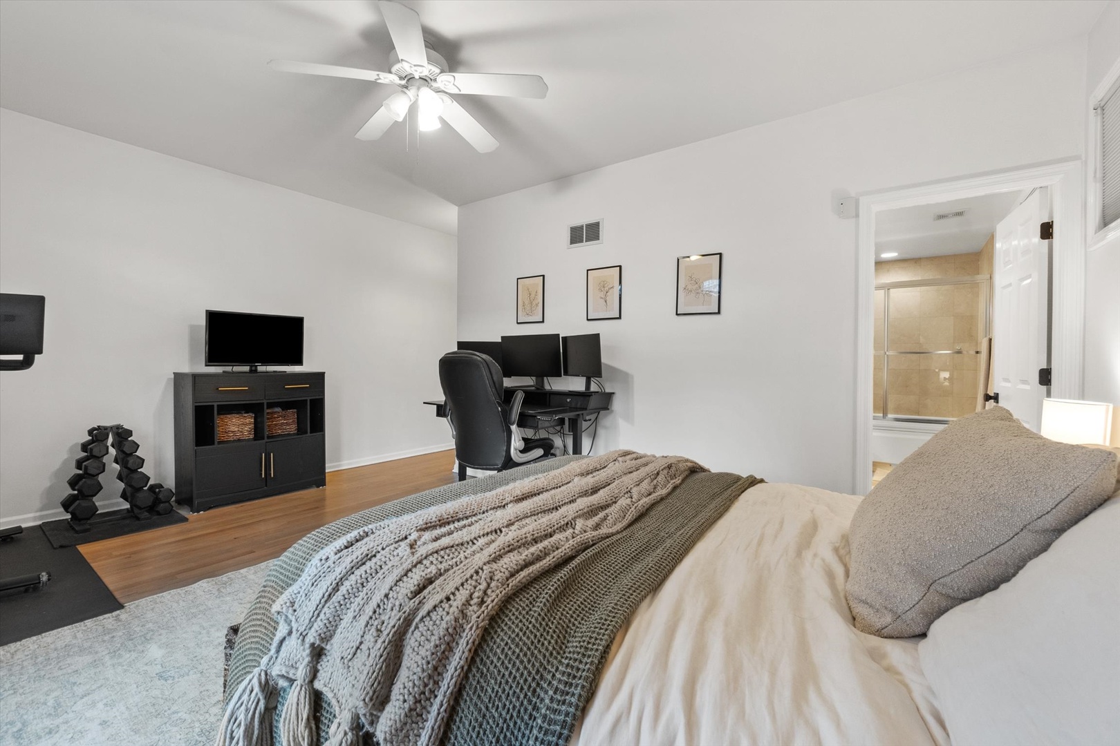 3531 North Reta Avenue, Unit 1 Chicago, IL 60657 - Photo 19 of 63 a bedroom with a bed and a chandelier