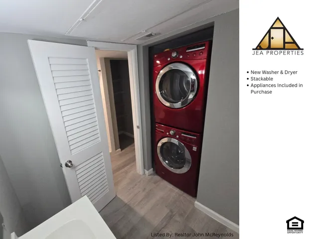 a view of a hallway with washer and dryer