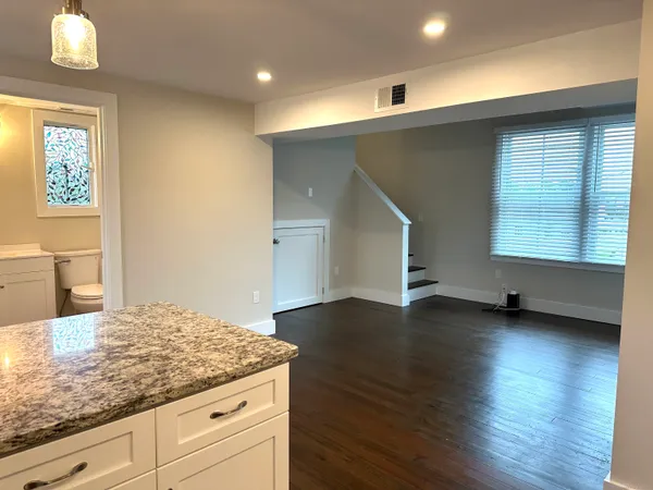 a kitchen with sink and cabinets
